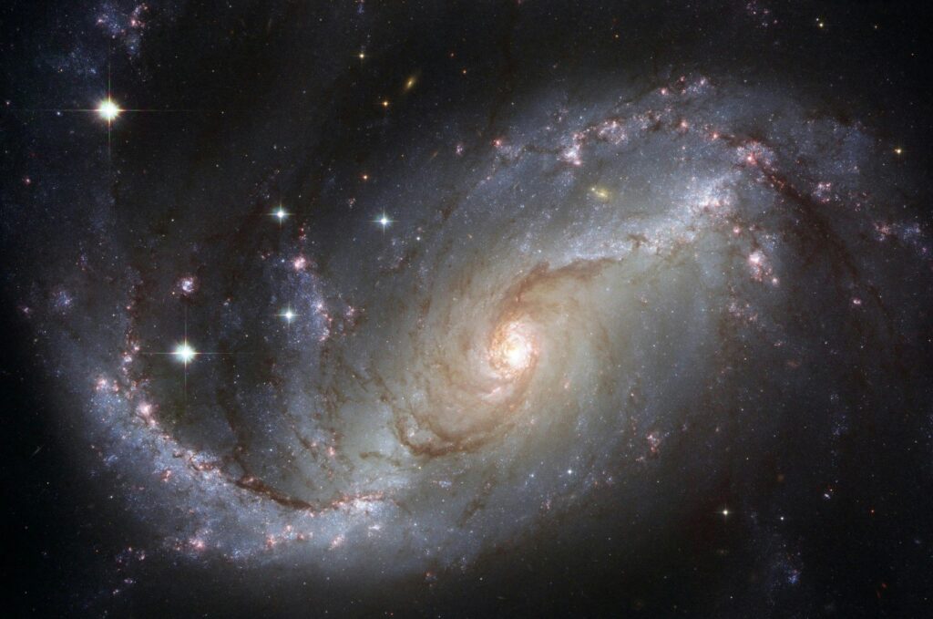 Capture of the NGC 1672 spiral galaxy showcasing its majestic spiral arms and bright core.